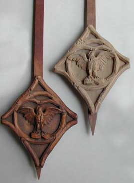 Carved clock pendulums